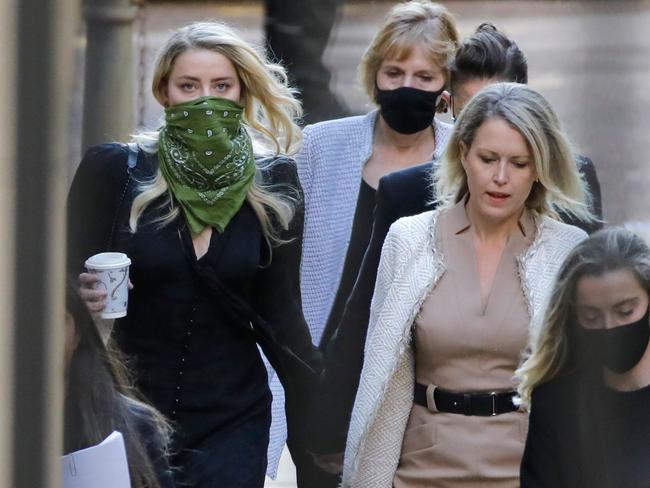 Amber Heard, left, outside a London court today. Picture: AFP