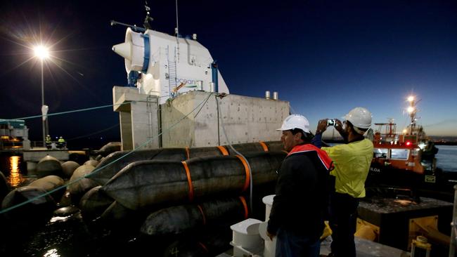 The Oceanlinx wave generator is towed out from TechPort, to be 