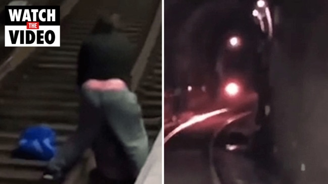 Heart-stopping moment a train speeds towards an unconscious person