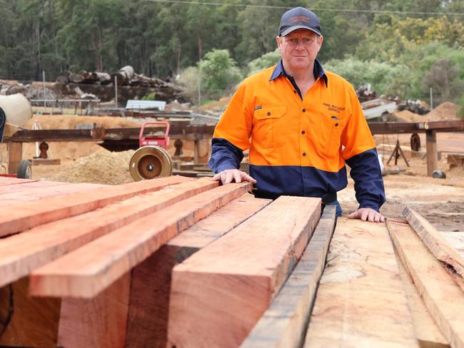 Mr Branson with jarrah timber. Picture: Charlie Peel