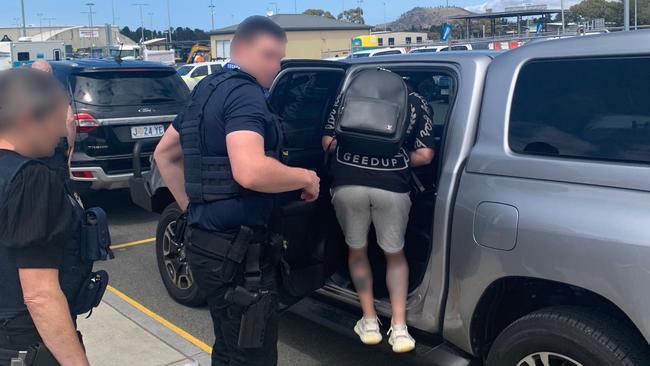 A 38-year-old Alexandria man being arrested at Hobart Airport on Thursday, November 9, 2023. Picture: AFP/ Tasmania Police