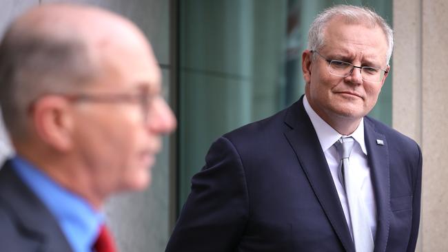 CANBERRA, AUSTRALIA - SEPTEMBER 4: Australian Prime Minister Scott Morrison listens to Australian Acting Chief Medical Officer Paul Kelly during a media conference at Parliament House on September 4, 2020 in Canberra, Australia. (Photo by David Gray/Getty Images)