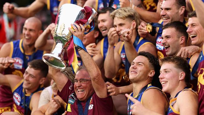 MELBOURNE, AUSTRALIA - SEPTEMBER 28: Chris Fagan, Senior Coach of the Lions celebrates with his players after winning the AFL Grand Final match between Sydney Swans and Brisbane Lions at Melbourne Cricket Ground, on September 28, 2024, in Melbourne, Australia. (Photo by Cameron Spencer/AFL Photos/via Getty Images)