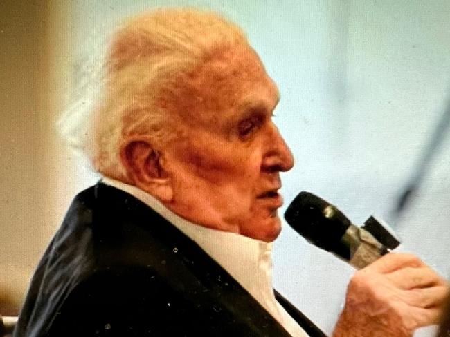 John Laws speaking at the funeral.