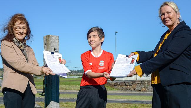 11-year-old Olivia Bastion holds up a petition to save Liverpool Academy from closure during the pandemic. She’s accompanied by Lismore MP Janelle Saffin and Shadow Minister for Sport and Recreation Lynda Voltz.