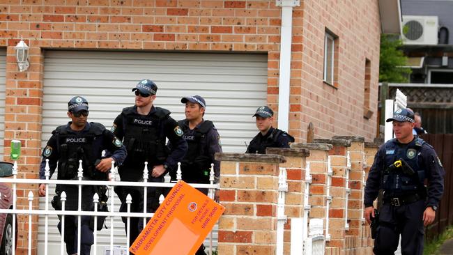 Australian Federal Police and NSW Police counter terrorism officers Azari’s Western Sydney home. Picture: John Grainger