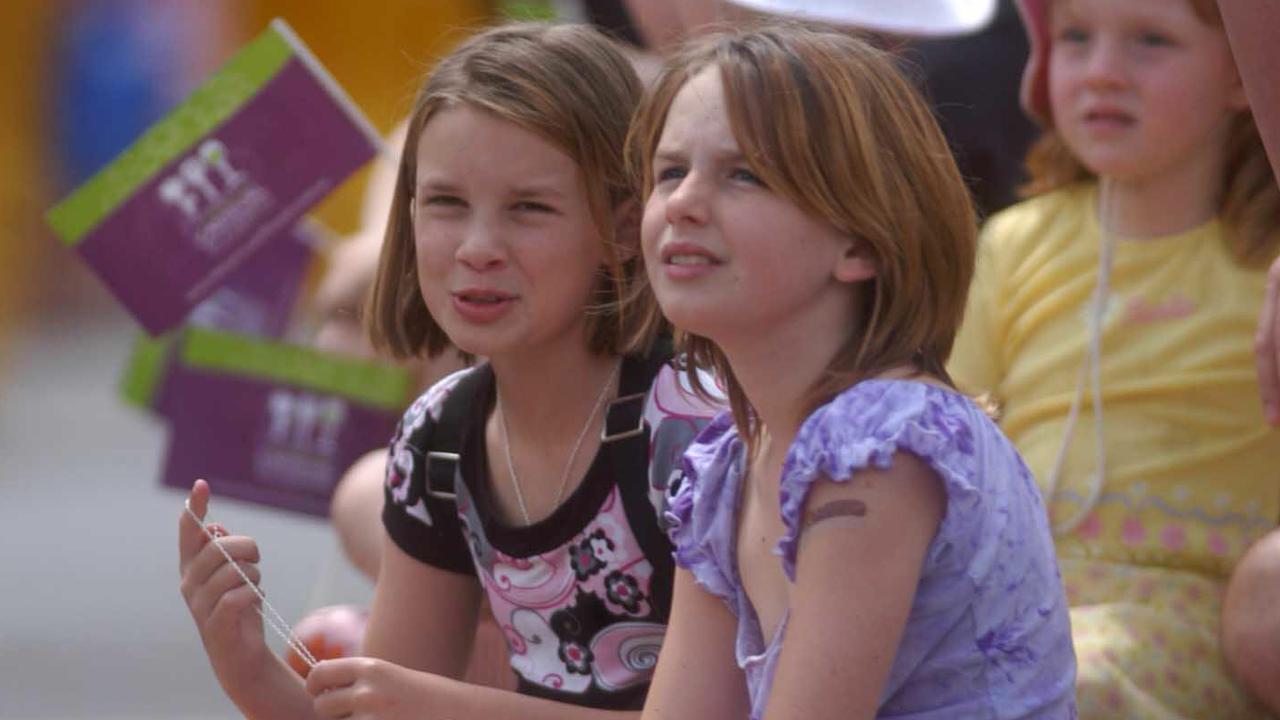 Positioned in a prime spot Tenealle Welch 10yr with her friend Jasmine Sims 10yr (Pittsworth) to watch the 58th Toowoomba Carnival of Flowers street parade through the City. Picture: David Martinelli.