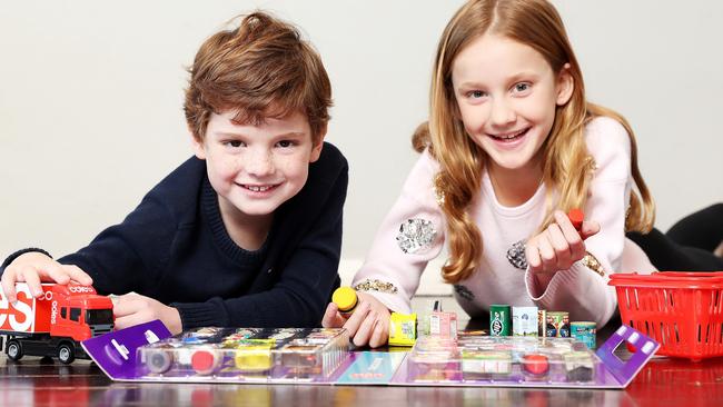 Billy Keating, 5, and Ava Keating, 9, with the Coles mini collectables. Picture: Tim Hunter.