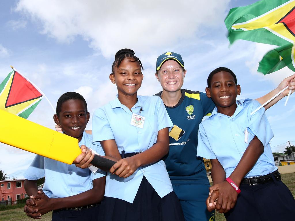 Alyssa Healy with local children during a Schools and Community Outreach Program session at East Reimveldt Secondary School in Guyana. Pic: Getty Images