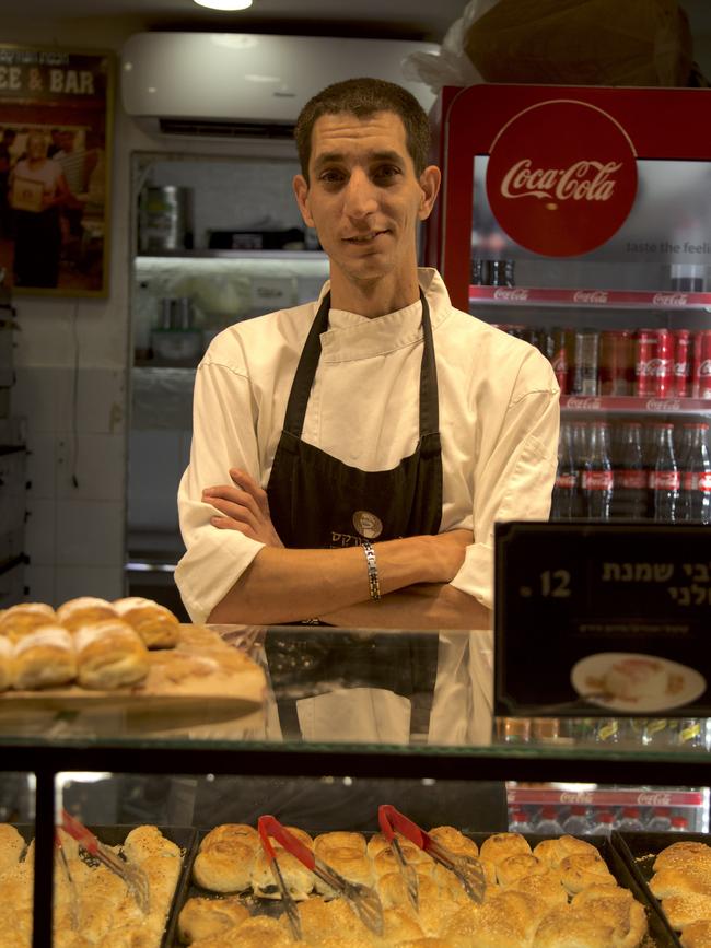 Netanel Reuven at Wisdom of the Burekas, a shop inside the Jerusalem market. He says business has been terrible since the war.