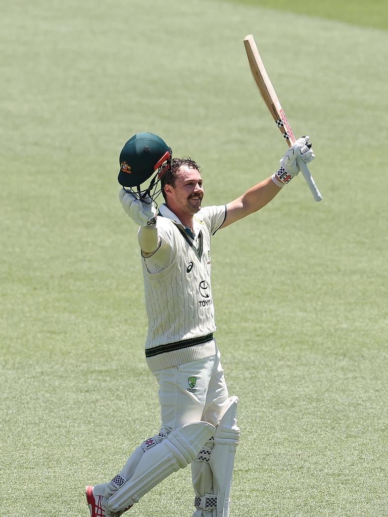 Travis Head celebrates a gritty century at his home ground the Adelaide Oval on Thursday. Picture: Paul Kane/Getty Images.