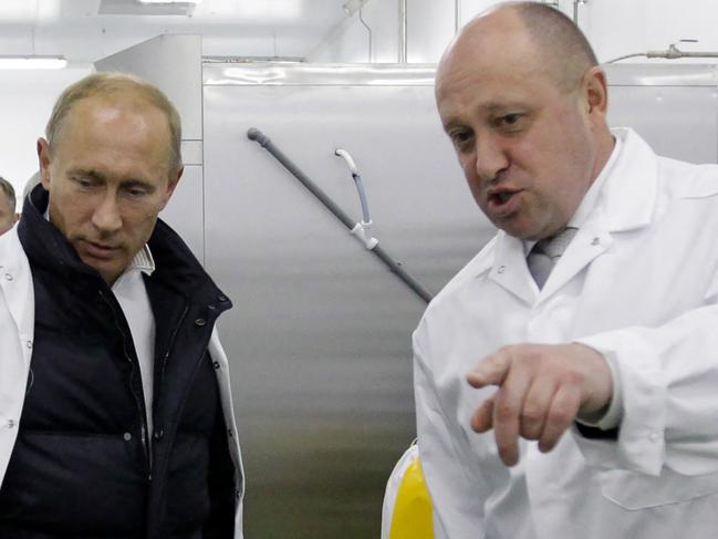 Yevgeny Prigozhin (right) shows Russian Prime Minister Vladimir Putin his school lunch factory outside Saint Petersburg in2010. Picture: AFP