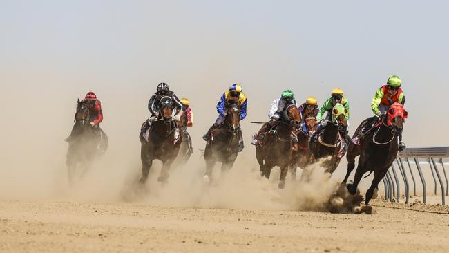 Steeds kick up the dust at last year’s Birdsville Races. Picture: Salty Dingo