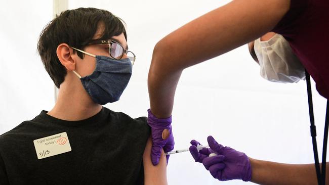 Oliver Barr, 13, receives his Covid-19 vaccine in Los Angeles in May. Picture: AFP