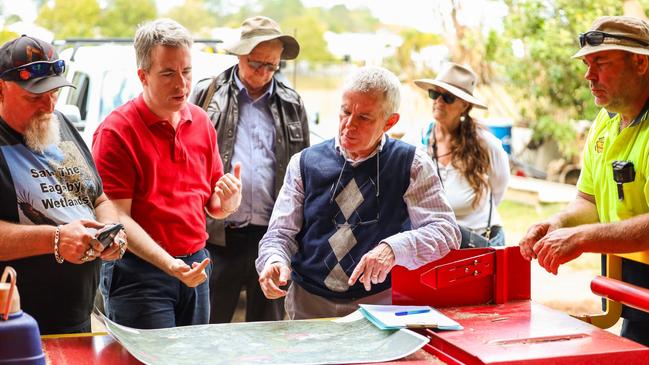 Queensland Senator Malcolm Roberts, third from right, meets with Eagleby residents to discuss the Coomera Connector and its route through the local wetlands. Pictures: Contributed