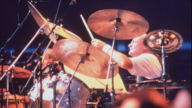 Actor singer Phil Collins playing drums.