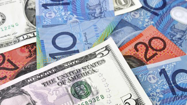 A Combination of US and Australian Dollars banknotes. investing, generic, Australian money