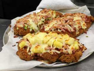 The mouthwatering Hawaiian, golden buick and traditional chicken parmies served up at the Royal Hotel in Yarraman. Picture: Laura Blackmore