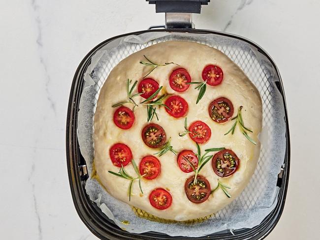 Add tomatoes to the dough.