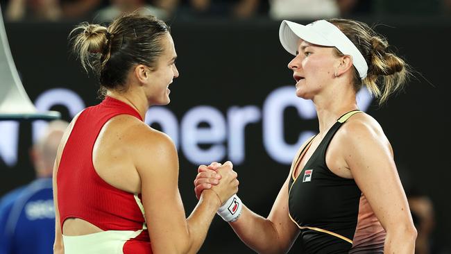 MELBOURNE, AUSTRALIA - JANUARY 23: Aryna Sabalenka (L) embraces Barbora Krejcikova of Czech Republic after winning their quarterfinals singles match during the 2024 Australian Open at Melbourne Park on January 23, 2024 in Melbourne, Australia. (Photo by Cameron Spencer/Getty Images)