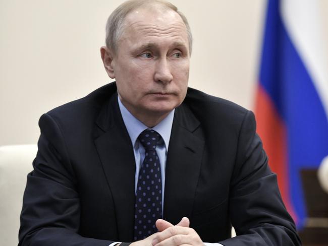 Russian President Vladimir Putin listens during a meeting at the Novo-Ogaryovo residence outside Moscow, Russia, Tuesday, April 17, 2018. (Alexei Nikolsky, Sputnik, Kremlin Pool Photo via AP)