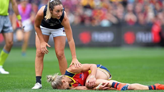 DOWN AND OUT: Crows star Erin Phillips writhes in pain after shredding her left ACL in the AFLW grand final against Carlton. Picture: TOM HUNTLEY.