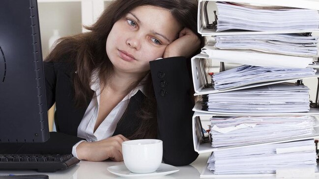 Stressed Woman Working In Office