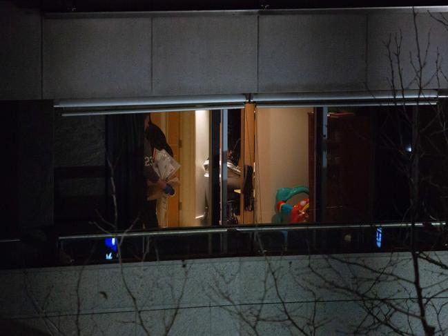 Police searching Doudar and Nazlioglu’s apartment at 1 Macquarie Street.