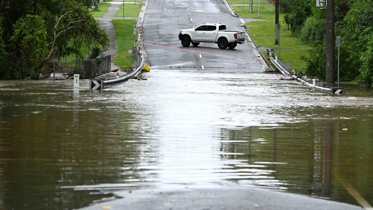 Flash flooding on low lying roads in Springfield Lakes and Redbank areas after more than 130mm rain. Picture: Lyndon Mechielsen/Courier Mail