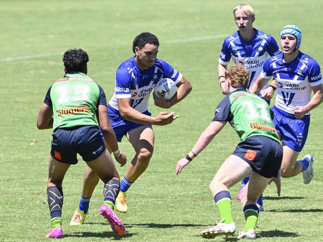 James Selesele Peni runs at Sonny Lauvao (left) and Kodi Roberts. Picture: Martin Ollman