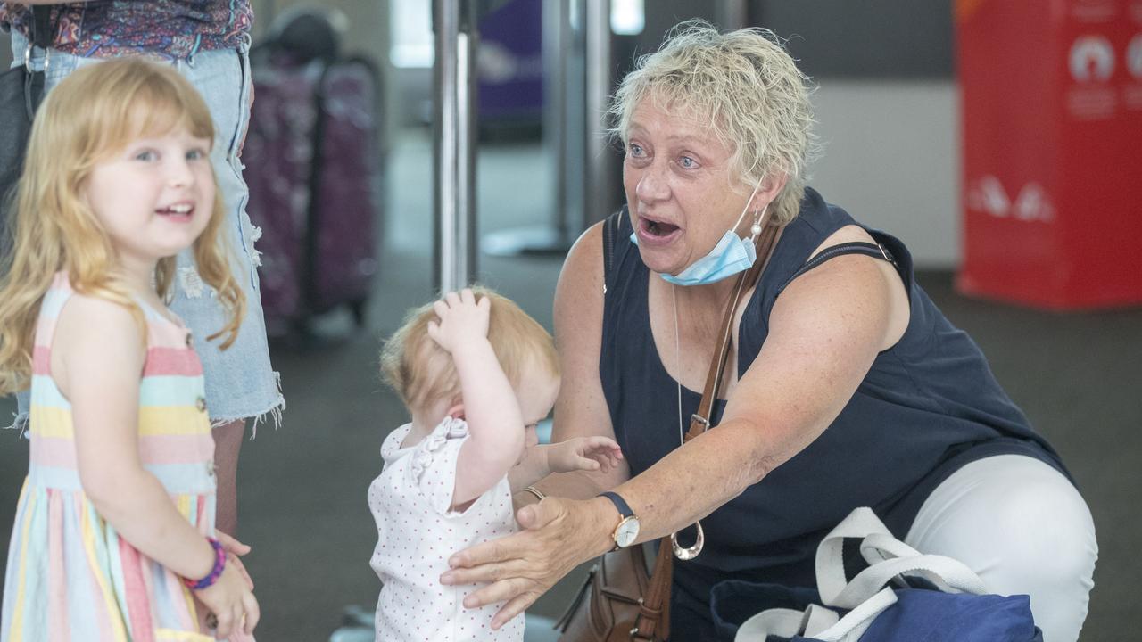 Linda O'Rourke meeting her grand children. Families welcome other family members as they return to Brisbane. Picture: Peter Wallis