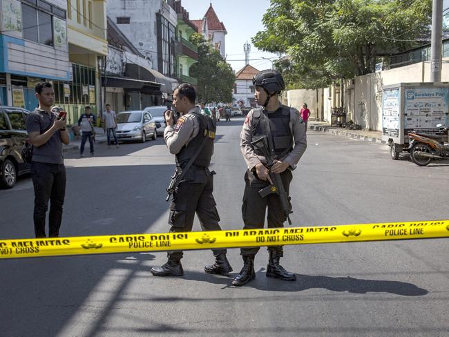 Indonesian police stand guard outside the Surabaya police station following another explosion on May 14, 2018 in Surabaya. Picture: Getty