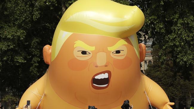 The six-metre-high Trump baby protest blimp may soon be notching up frequent flyer points in Australia. Picture: AP/Matt Dunham