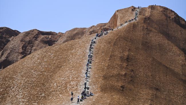 Tourists <s1><span id="U703454262083EB" style="font-stretch:7.9;">flocked to Uluru to climb Uluru before it was closed but now visitor numbers to the Central Australian hot spot have dropped. </span></s1> <source>Picture: AAP IMAGE/LUKAS COCH</source>