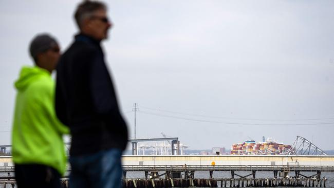 People look out toward the Francis Scott Key Bridge, following its collapse. Picture: AFP