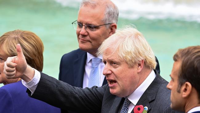 British Prime Minister Boris Johnson (2nd R) stands with Chancellor of Germany, Angela Merkel (L), Scott Morrison (2nd L) and French President Emmanuel Macron (R), during a visit to the Trevi fountain. Picture: Getty Images