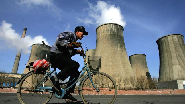 China’s central government looks ready to increase its 1100GW coal power cap. In the background, vapour from cooling towers of a coal plant. Picture: AP