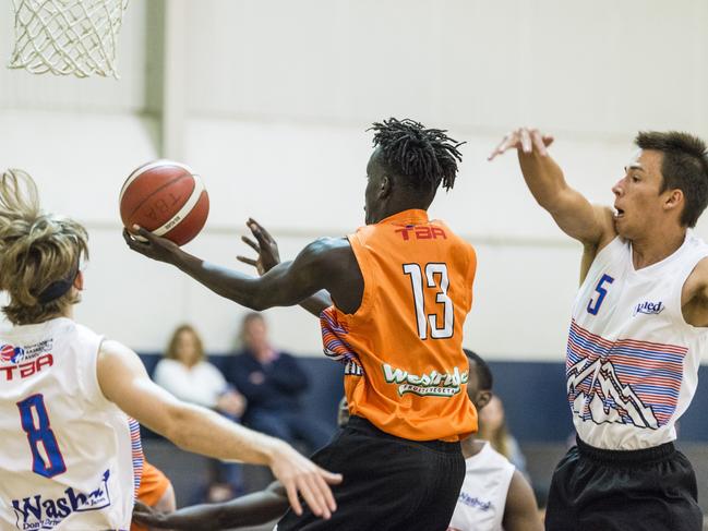 Deng Makuach under the basket for Westridge Fruit and Veg Warriors against Washed on James Mustangs in Toowoomba Basketball League preliminary final at Clive Berghofer Arena, St Mary's College, Monday, March 15, 2021. Picture: Kevin Farmer