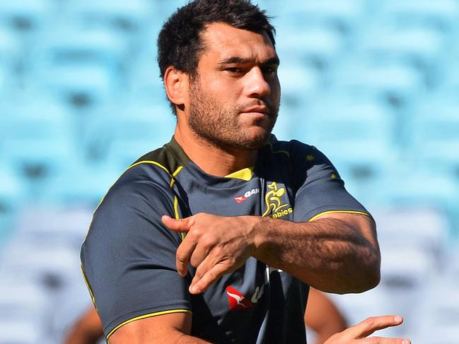 (FILES) In this file photo taken on July 5, 2013 Australian Wallabies rugby player flanker George Smith passes the ball at the Captain's Run training session ahead of their final rugby Test match against the British and Irish Lions in Sydney. - Wallabies great George Smith announced his retirement on May 21, 2019 after a stint with Bristol in the England Premiership, calling time on nearly 20 years playing rugby. (Photo by William WEST / AFP) / -- IMAGE RESTRICTED TO EDITORIAL USE - STRICTLY NO COMMERCIAL USE --