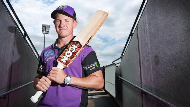 TRIBUTE: Hobart Hurricanes’ D'Arcy Short with a custom bat featuring artwork created by Cairns indigenous artist Marcus McGregor-Cassady. Picture: LUKE BOWDEN