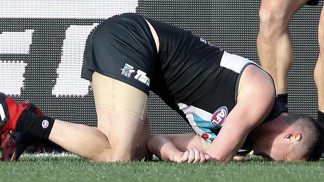 Port’s Tom Rockliff down with a shoulder injury during the West Coast game. Picture: Sarah Reed