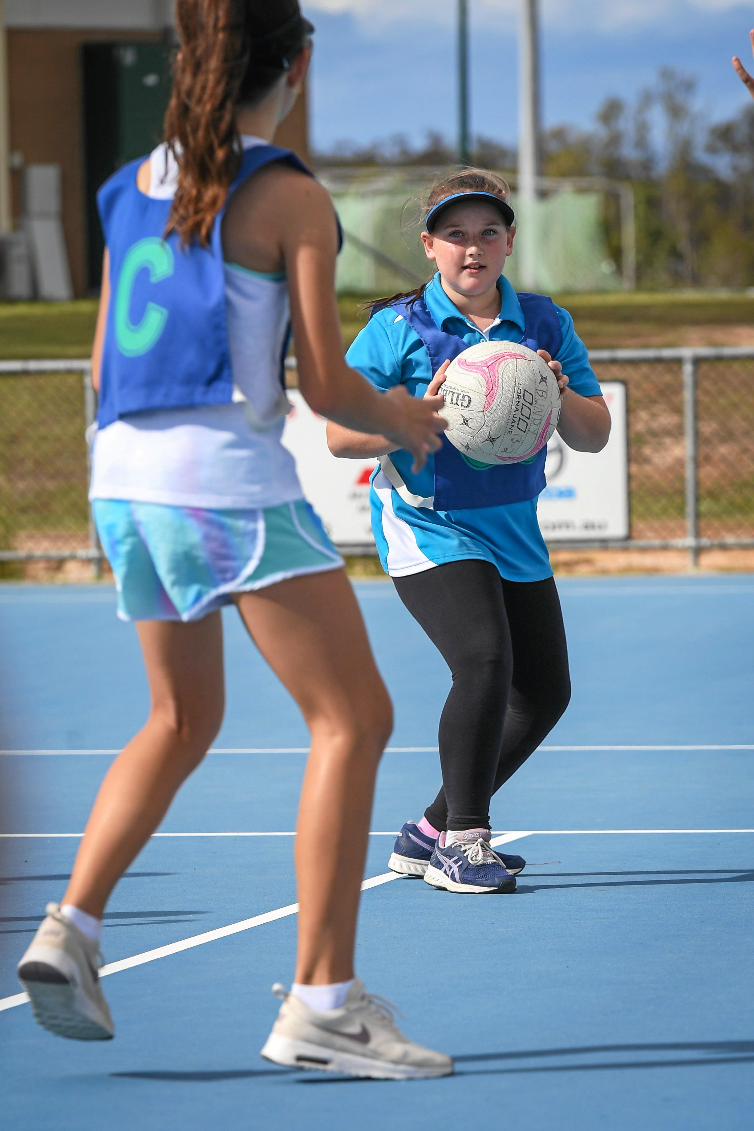 Sieanna Baldry-Short with the ball at the Firebirds Netball Clinic. Picture: Brian Cassidy