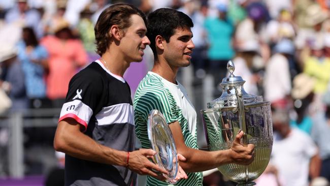 LONDON, ENGLAND - JUNE 25: Runner-up, Alex De Minaur of Australia and Winner, Carlos Alcaraz of Spain, pose with their trophies after the Men's Singles Final match on Day Seven of the cinch Championships at The Queen's Club on June 25, 2023 in London, England. (Photo by Clive Brunskill/Getty Images)