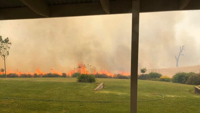 Fire came frighteningly close to Angus Campbell's Woodside home. He chose to stay and fight and has credited his bushfire action plan – which included soaking his house with sprinklers – for helping him "dodge a bullet". Picture: Angus Campbell