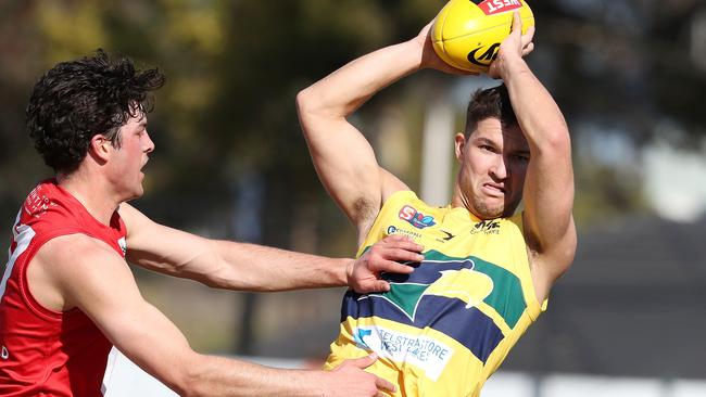 Gun Eagles recruit Sam Lowson takes a mark against North Adelaide. Picture: Sarah Reed