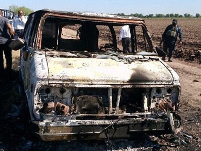 Shell ... The burnt out van of Dean Lucas and Adam Coleman who went missing while surfing in Mexico. Picture: Noroeste.com/Carlos Chaidez