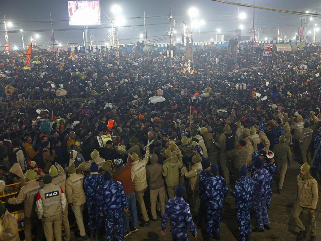 Security personnel try to control the pilgrims near the site of a stampede. Picture: AFP