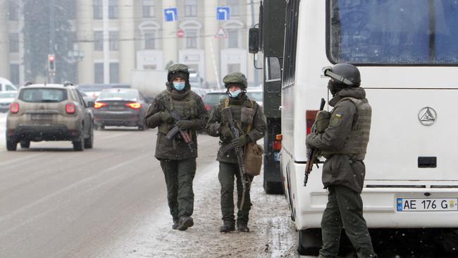 Law enforcement officers are seen on the premises of the Yuzhmash Machine-Building Plant in Dnipro, eastern Ukraine. Picture: Getty Images.