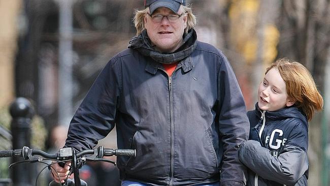 Academy Award-winner actor Philip Seymour Hoffman and his son Cooper Alexander walk back home after school.