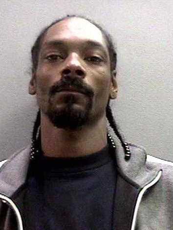 Snoop Dogg was booked on a felony charge of possession of a dangerous weapon in November 2006. Snoop (real name: Calvin Broadus) posed for the below mug shot while being processed by the Orange County Sheriff’s Department. He was charged in connection with an incident at John Wayne Airport during which security personnel discovered a collapsible baton in his luggage.